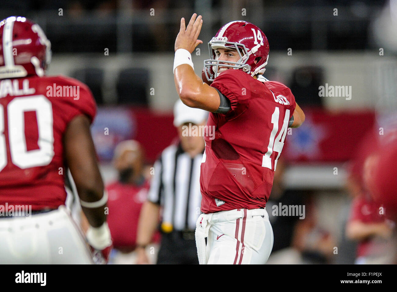 Alabama quarterback Jake Coker (14) warms up prior the Crimson Tide