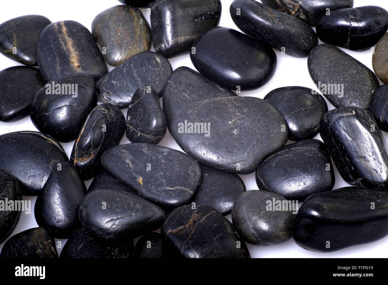 Black Rocks - White Background. Rocky Background Stock Photo