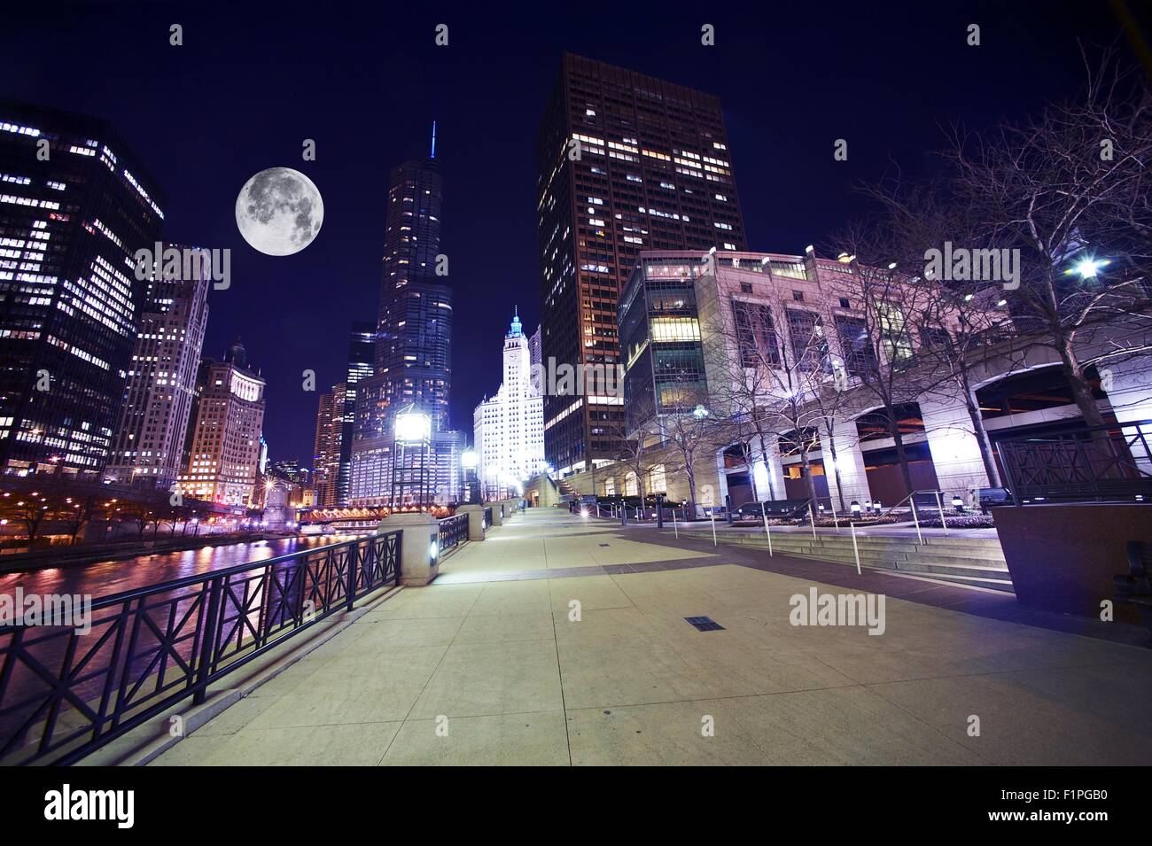 Chicago Famous Riverwalk - Chicago Riverwalk at Night. Beautiful Colorful Wide Angle Photography. Large Moon on the Sky. Chicago Stock Photo