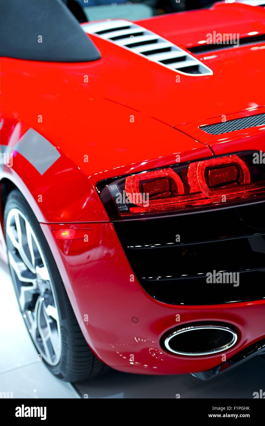 Really Fast Sporty Red Car - Rear Driver Side. Modern Performance Vehicle Closeup. Cars Photo Collection. Stock Photo