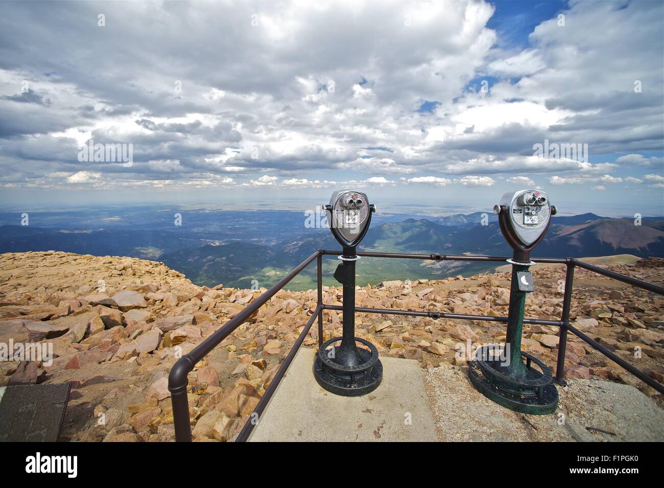 Pikes Peak Binoculars and Colorado Springs Under Cloudy Sky. Colorado USA. Pikes Peak East View. Stock Photo