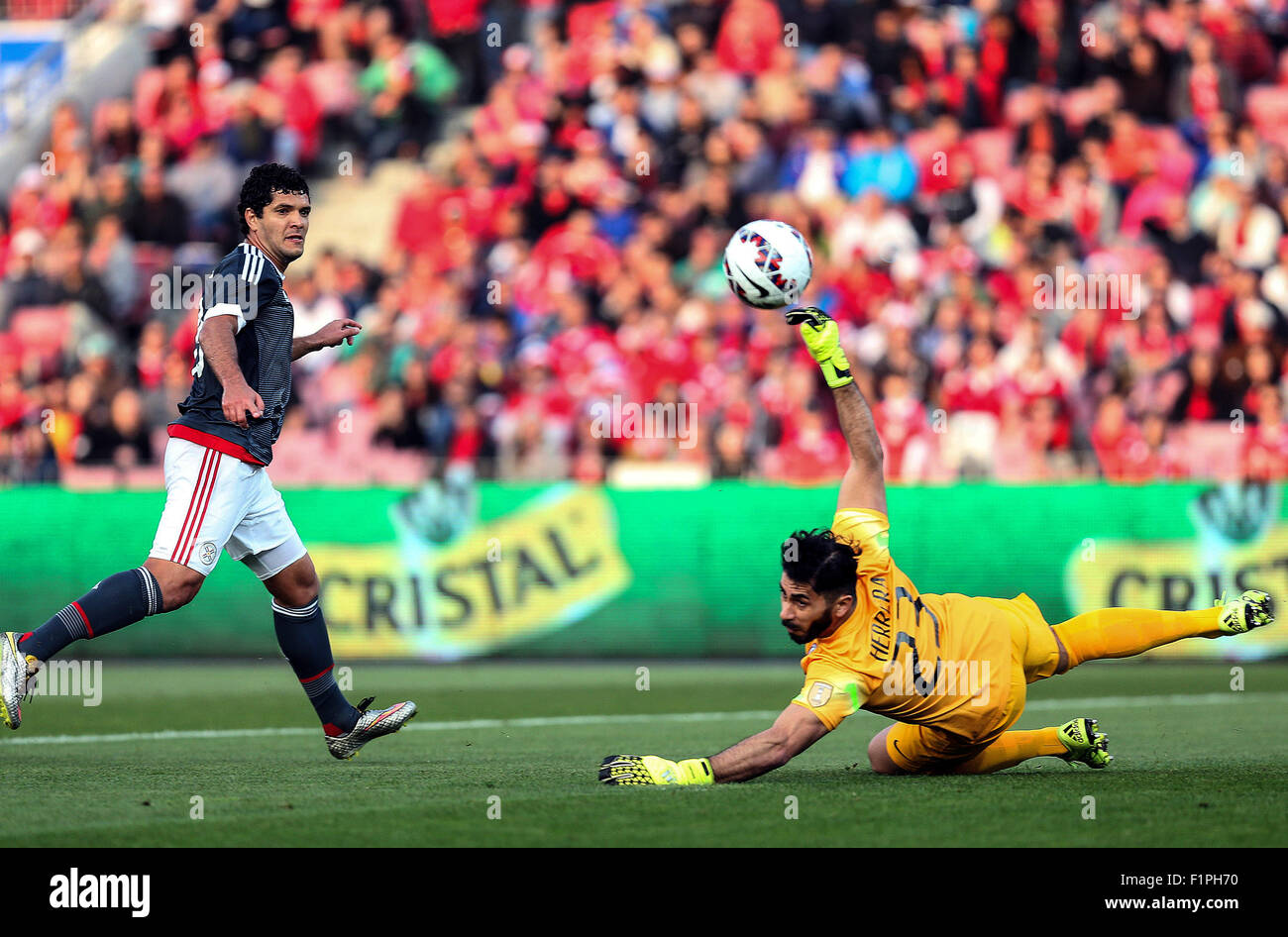 Santiago, Chile. 5th Sep, 2015. Image provided by Chile's National Professional Soccer Association (ANFP) shows Chile's goalkeeper Johnny Herrera (R) vying with Paraguay's Jose Ortigoza during a friendly match at the National Stadium in Santiago, Chile, on Sept. 5, 2015. Chile won the match. Credit:  ANFP/Xinhua/Alamy Live News Stock Photo