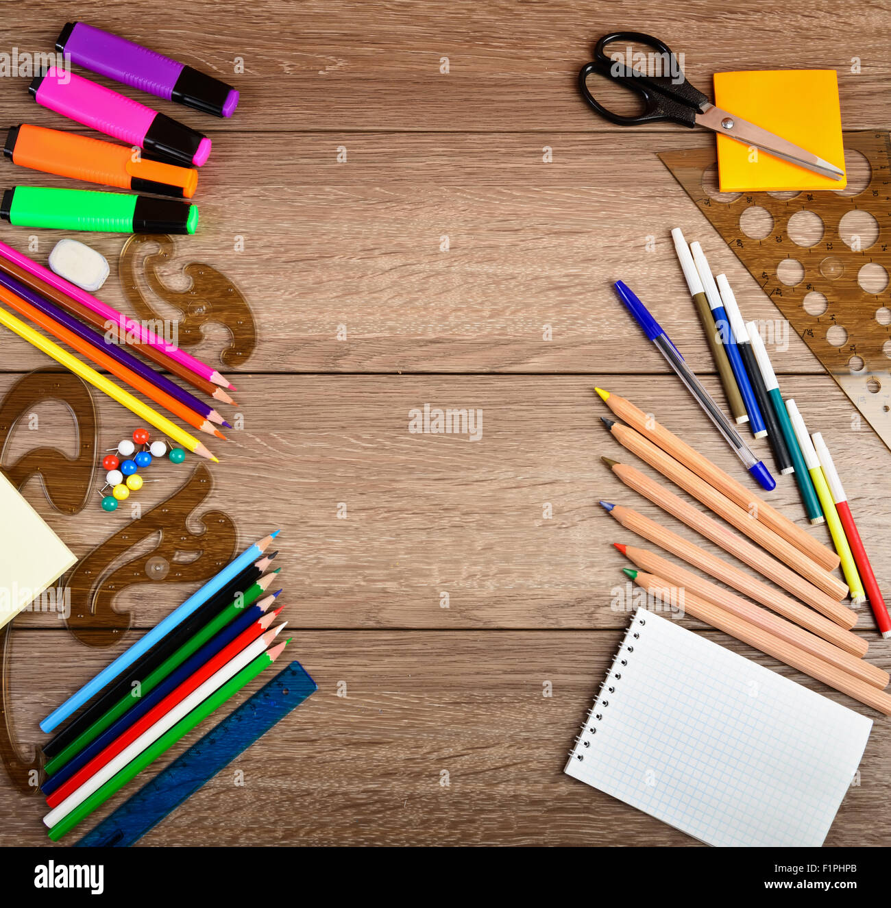 Premium Photo  Top view photo of backpack notebooks pencilcase scissors  drink bottle plastic alphabet letters binder clips plane shaped sharpener  pens adhesive tape stapler ruler calculator isolated blue background