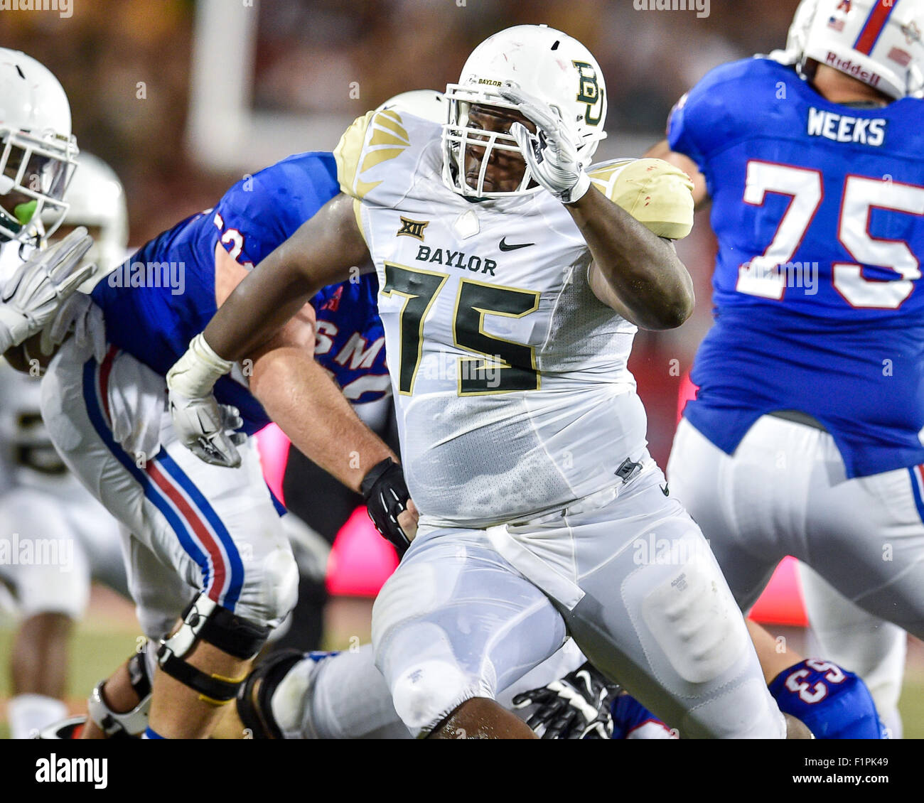 September 4th, 2015:.Baylor Bears defensive tackle Andrew Billings (75) rushes the line as he gets past Southern Methodist Mustangs offensive lineman Taylor Lasecki (52) and Southern Methodist Mustangs offensive lineman Evan Brown (63).during an NCAA Football game between the Baylor Bears and the SMU Mustangs at Gerald J. Ford Stadium in Dallas, Texas.Baylor wins 56-21.Manny Flores/CSM Stock Photo