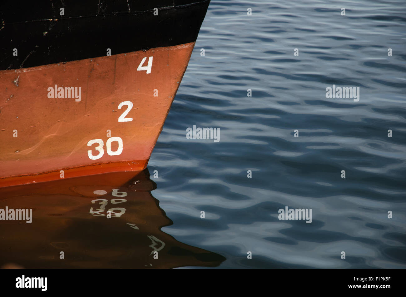 Numbers and reflections of a bow of a ship in water Stock Photo Alamy