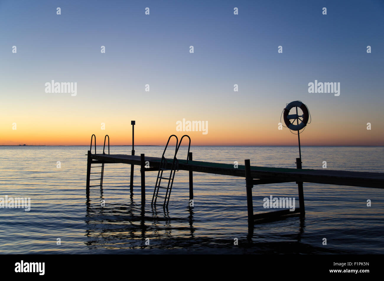 Old wooden bath pier at twilight at the swedish island Oland Stock Photo