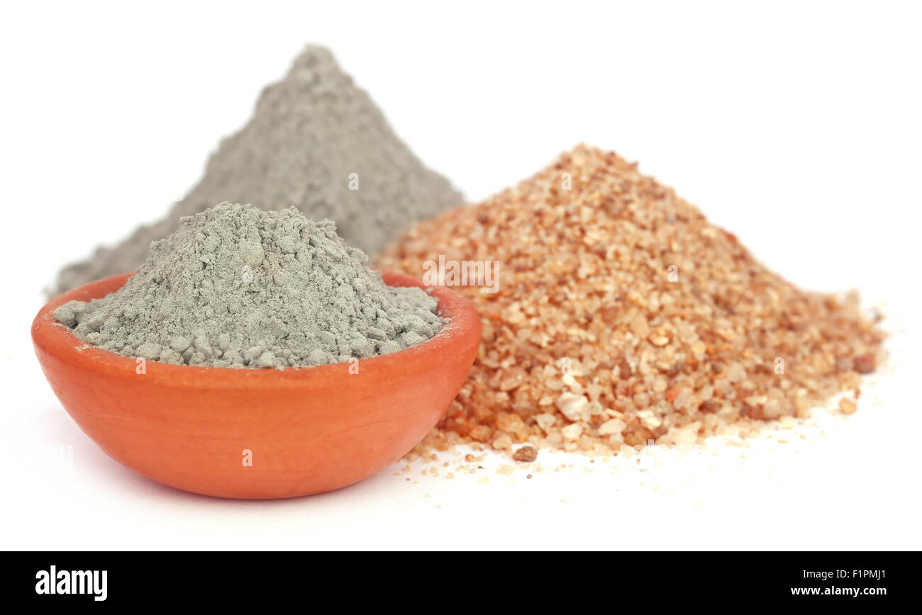Grady cement in a bowl with two types of sand over white background
