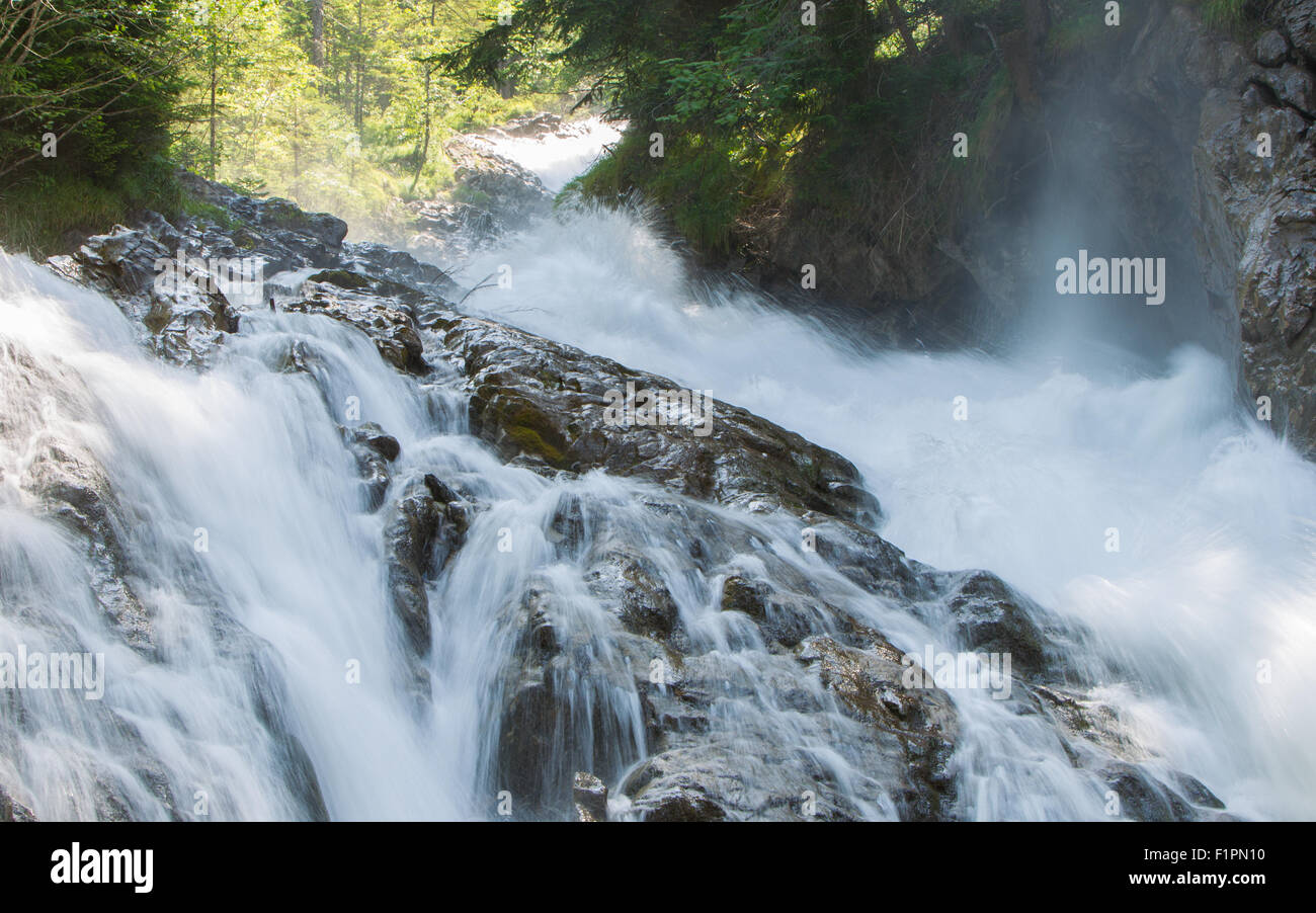 Waterfall in the forest, raging water in Switzerland Stock Photo - Alamy