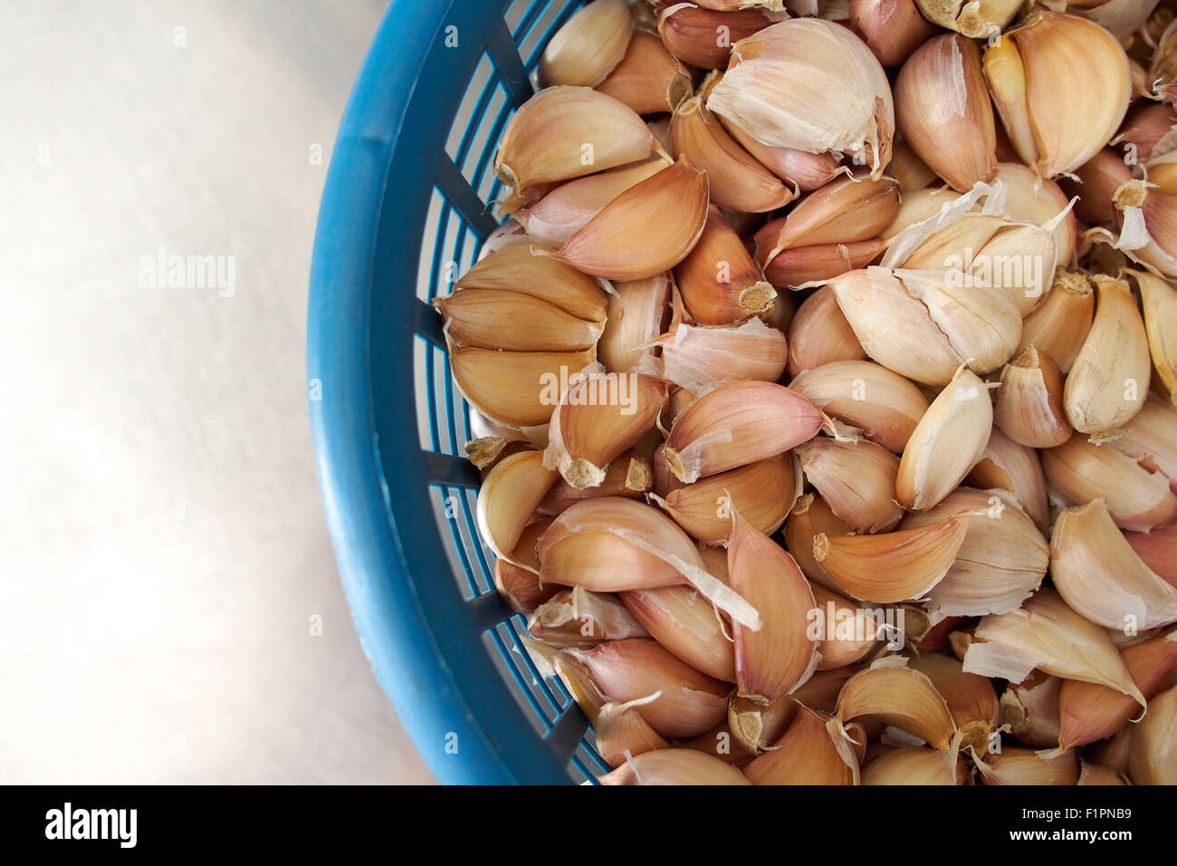 Garlic cloves in basket Stock Photo