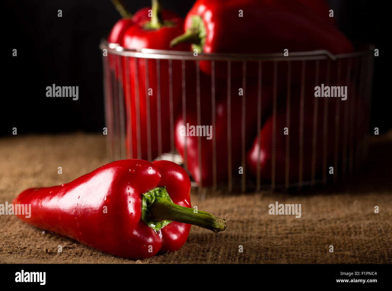 Fresh red hot chilli peppers on an old canvas rustic bag Stock Photo