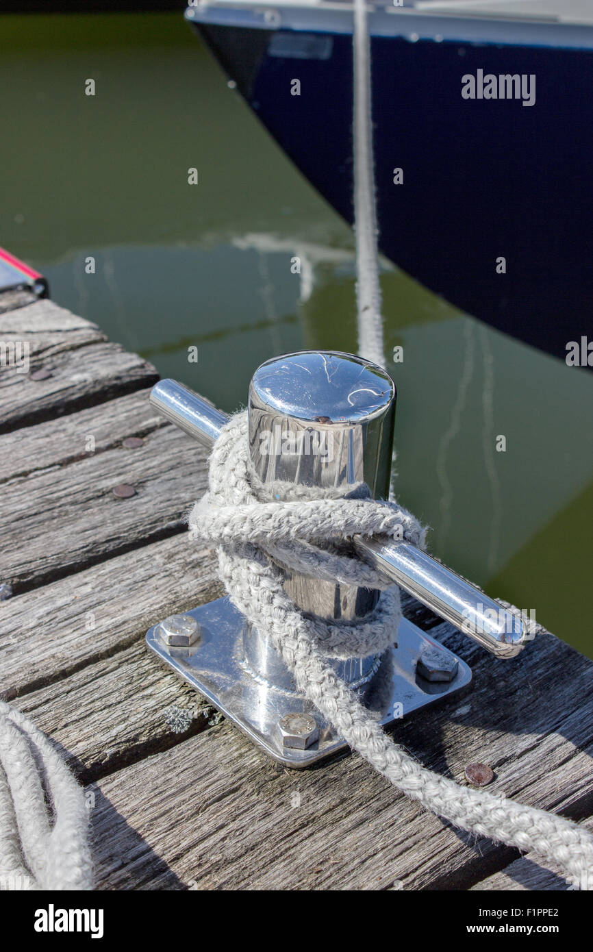 rope secured to a cleat on the dock Stock Photo Alamy