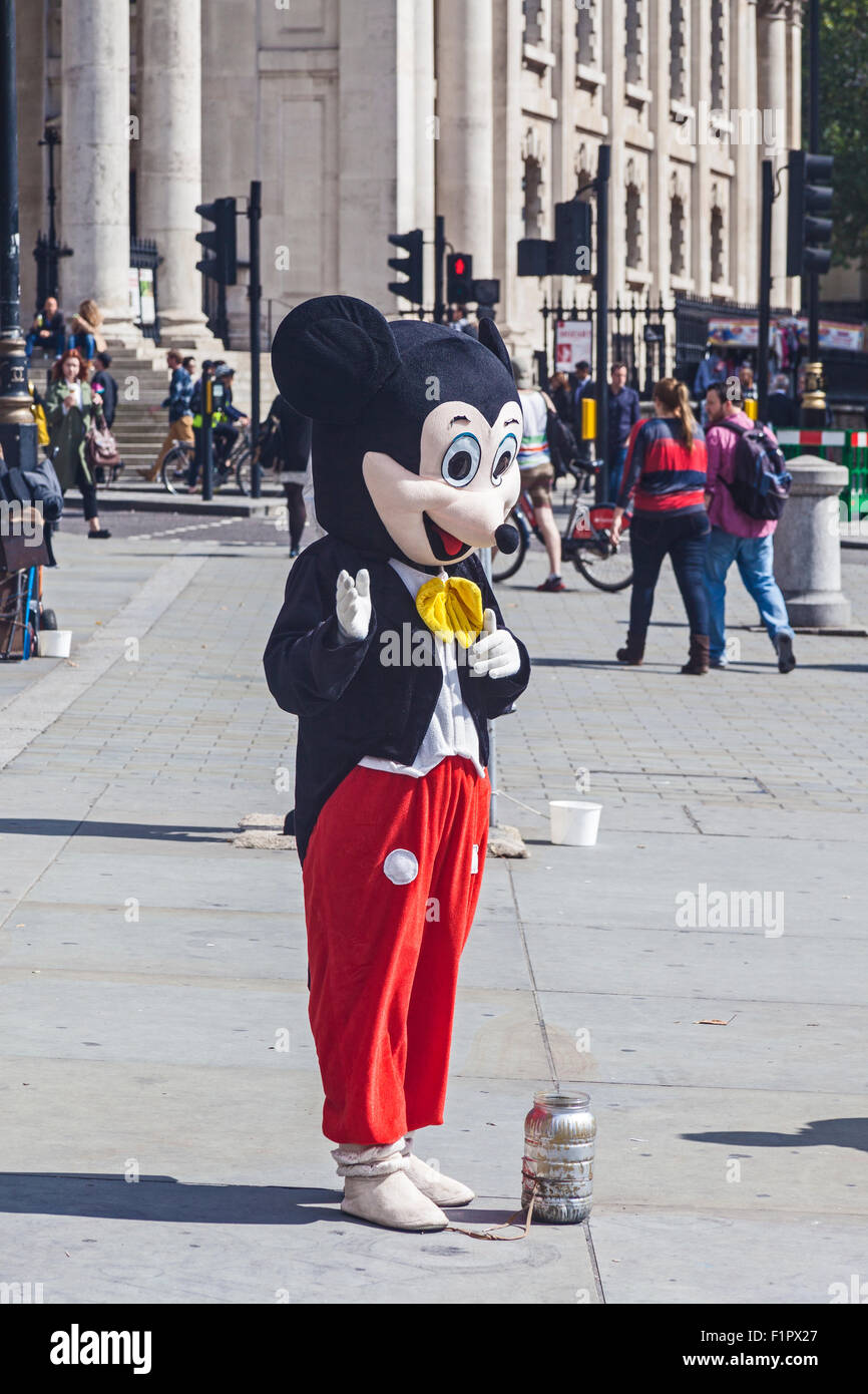 London, Trafalgar Square  Mickey Mouse entertaining the tourists Stock Photo