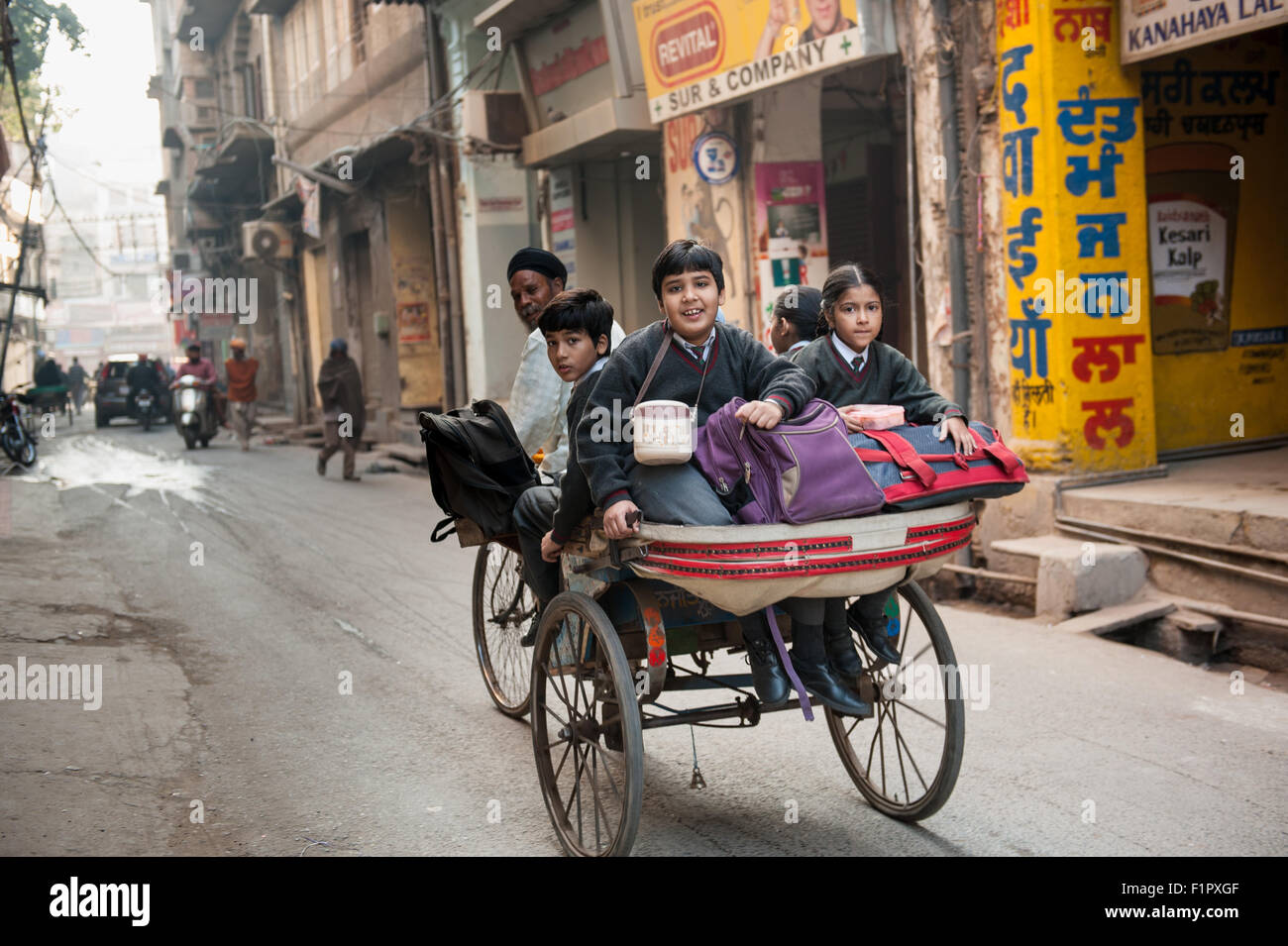 Amritsar, Punjab, India. Going to school in a rickshaw. Stock Photo