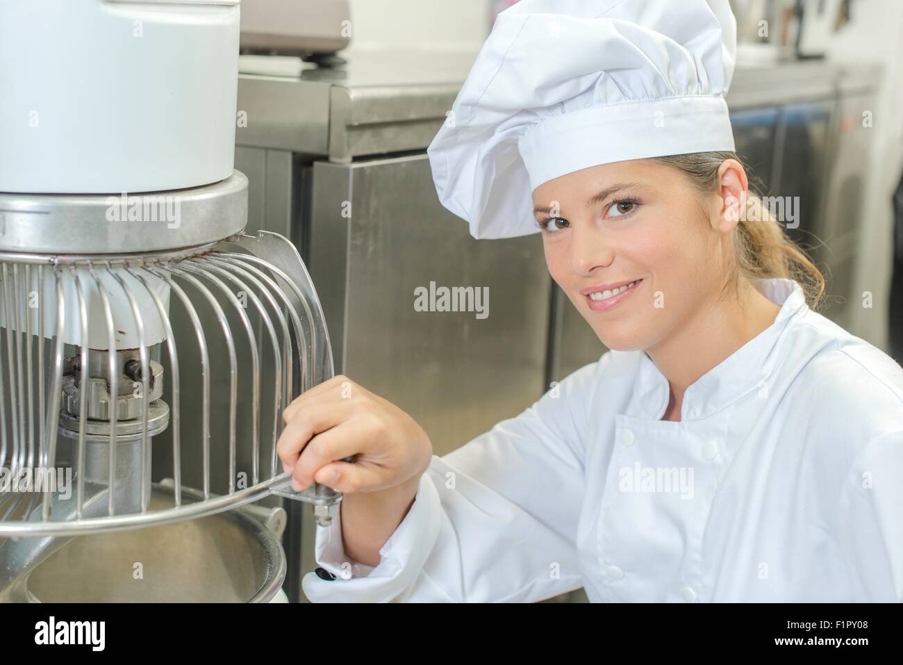 Baker using a mixing machine Stock Photo - Alamy Baker's machine shop