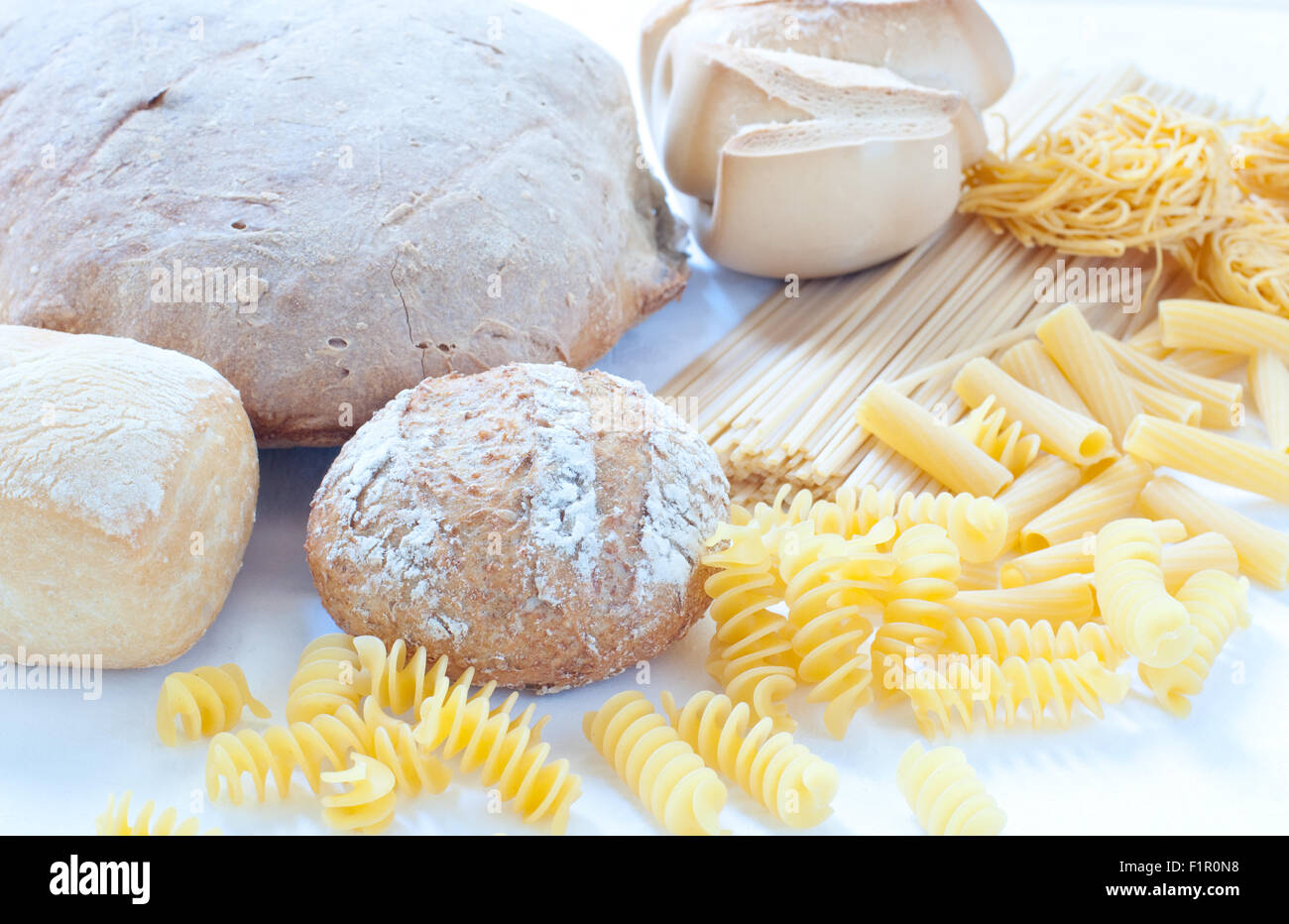 Different varieties of Italian pasta and homemade bread Stock Photo