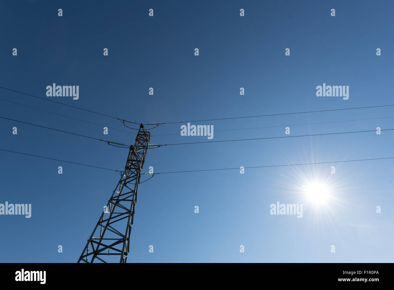 Power line isolated against the blue sky Stock Photo - Alamy