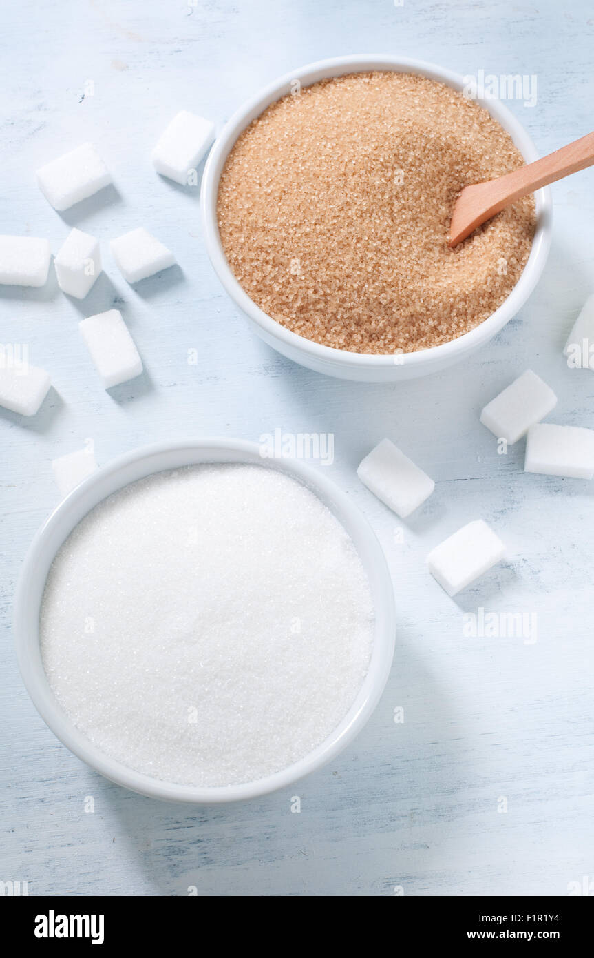 Different types of sugar: brown, white and refined sugar Stock Photo