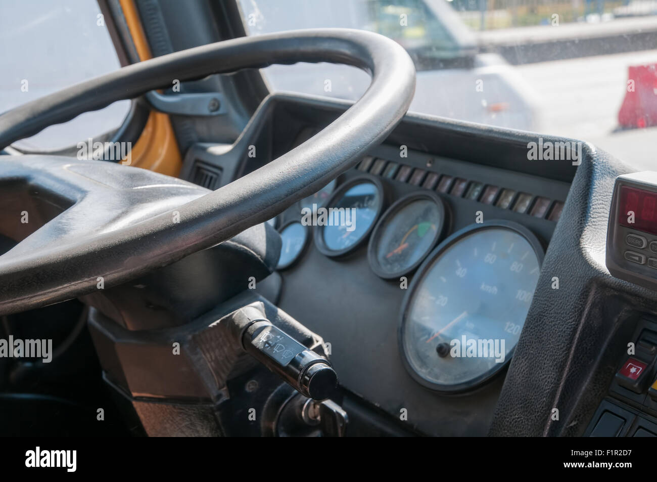 Truck cabin interior close up view - steering wheel and dashboard Stock Photo
