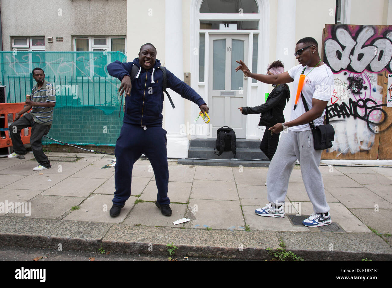 Group of guys dancing to music at I Spy The People sound system on