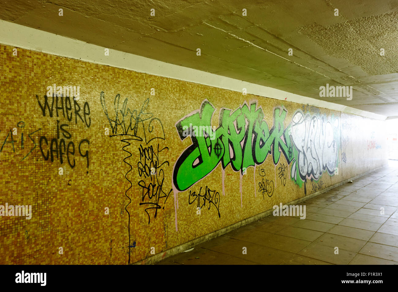 graffiti tags in underground empty walkway Birmingham UK Stock Photo