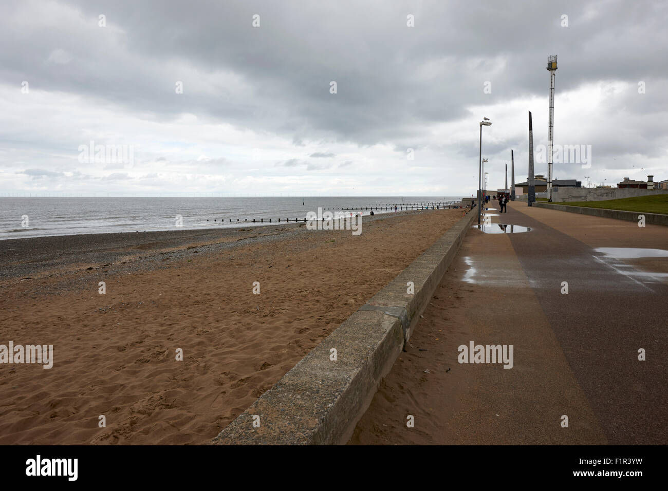 cold overcast day on empty rhyl beach august 2015 summer holidays north wales uk Stock Photo