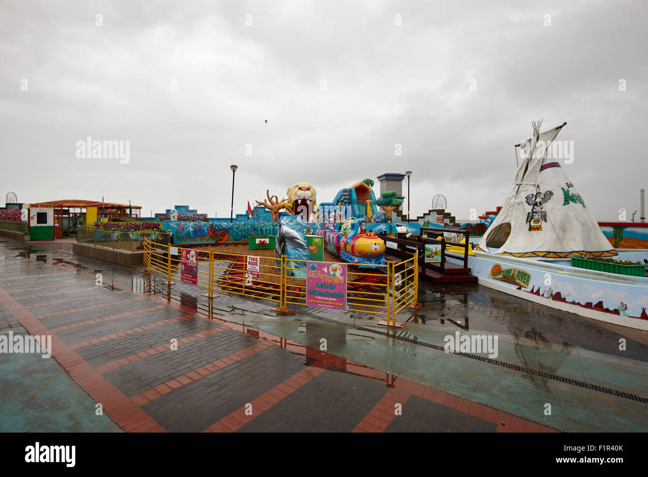 empty outdoor amusement park on a cold wet british summer day north wales uk Stock Photo