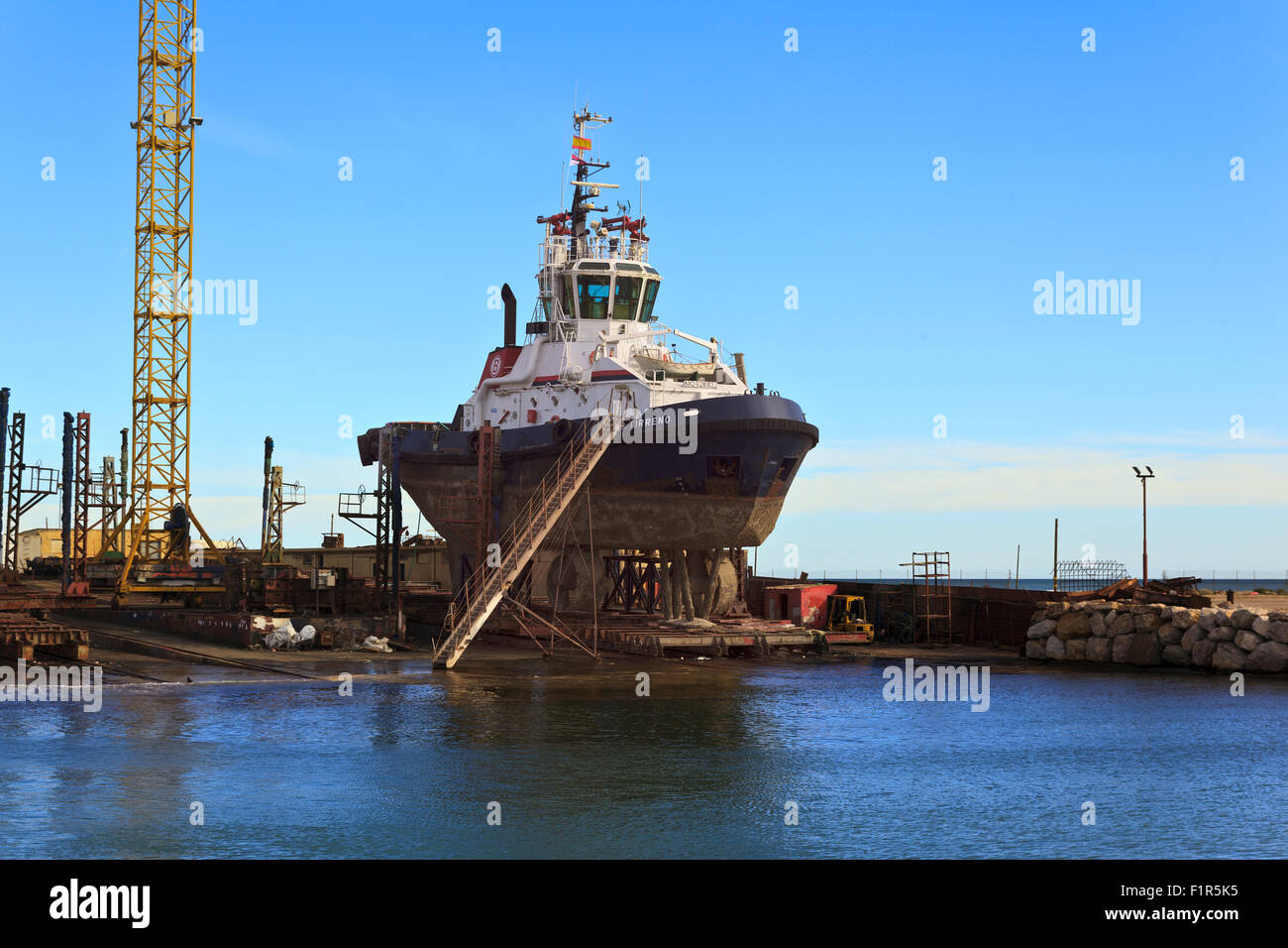 Tug Boat in Dry Dock in Puerto de Burriana Stock Photo