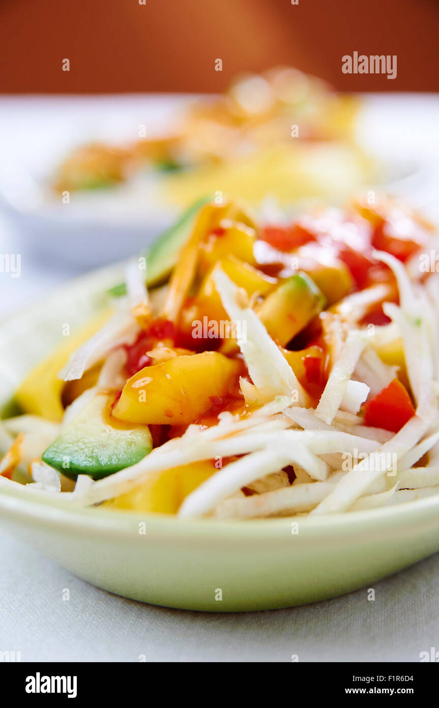 Crunchy Celery Root Salad with Mango Ginger Dressing Stock Photo