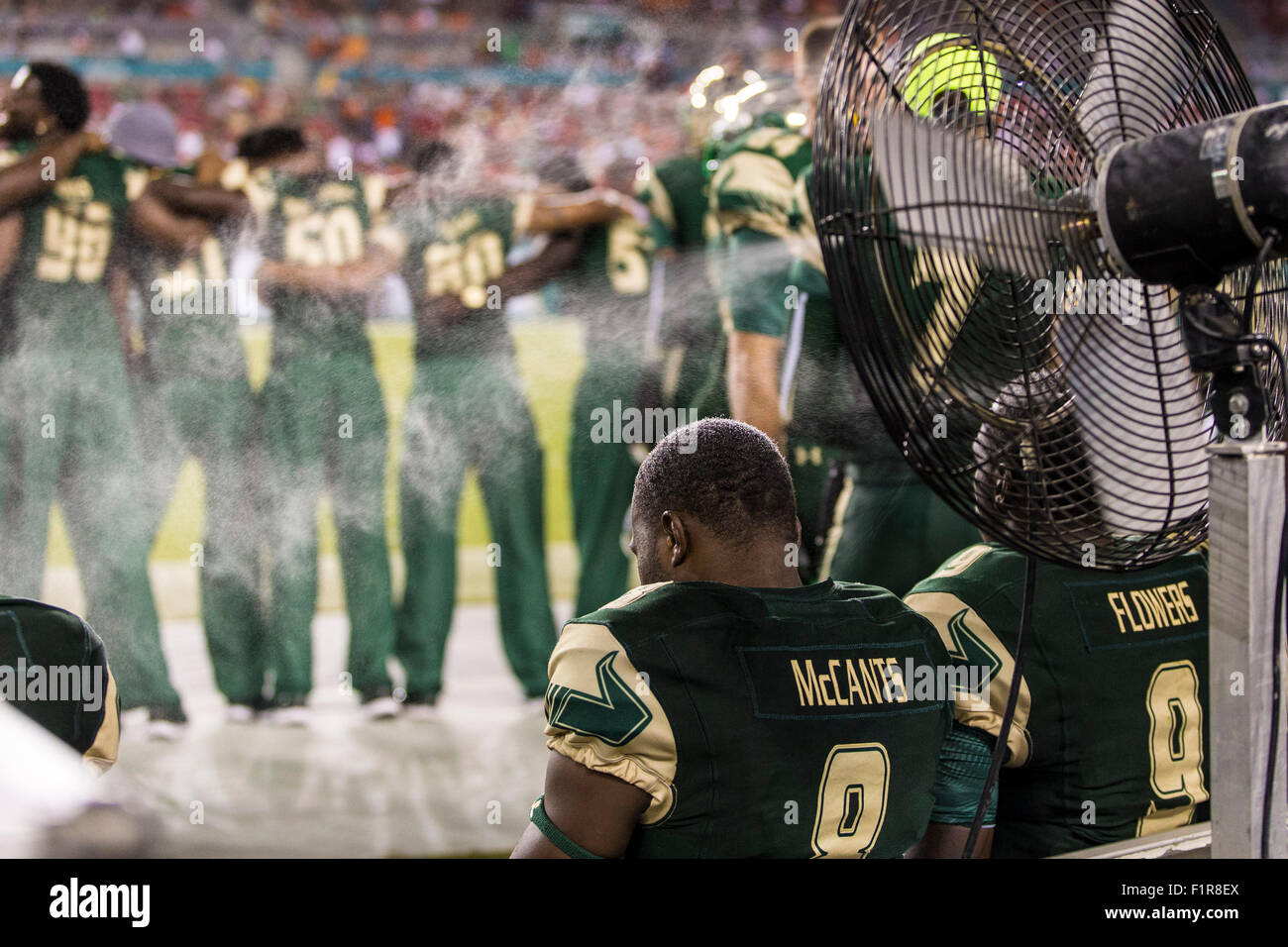 Tampa, Florida, USA. 5th September, 2015. South Florida Bulls wide receiver Tyre McCants #8 sits on the bench near a mist fan during the game between USF & Florida A&M at Raymond James Stadium in Tampa, FL Credit Image: Del Mecum Credit:  Cal Sport Media/Alamy Live News Stock Photo