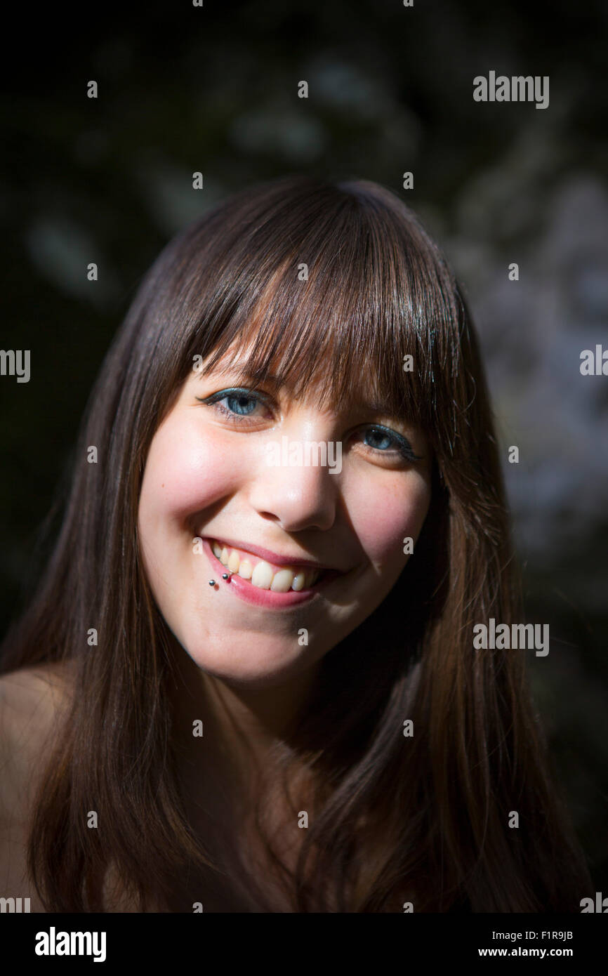 An attractive young brunette woman smiling Stock Photo