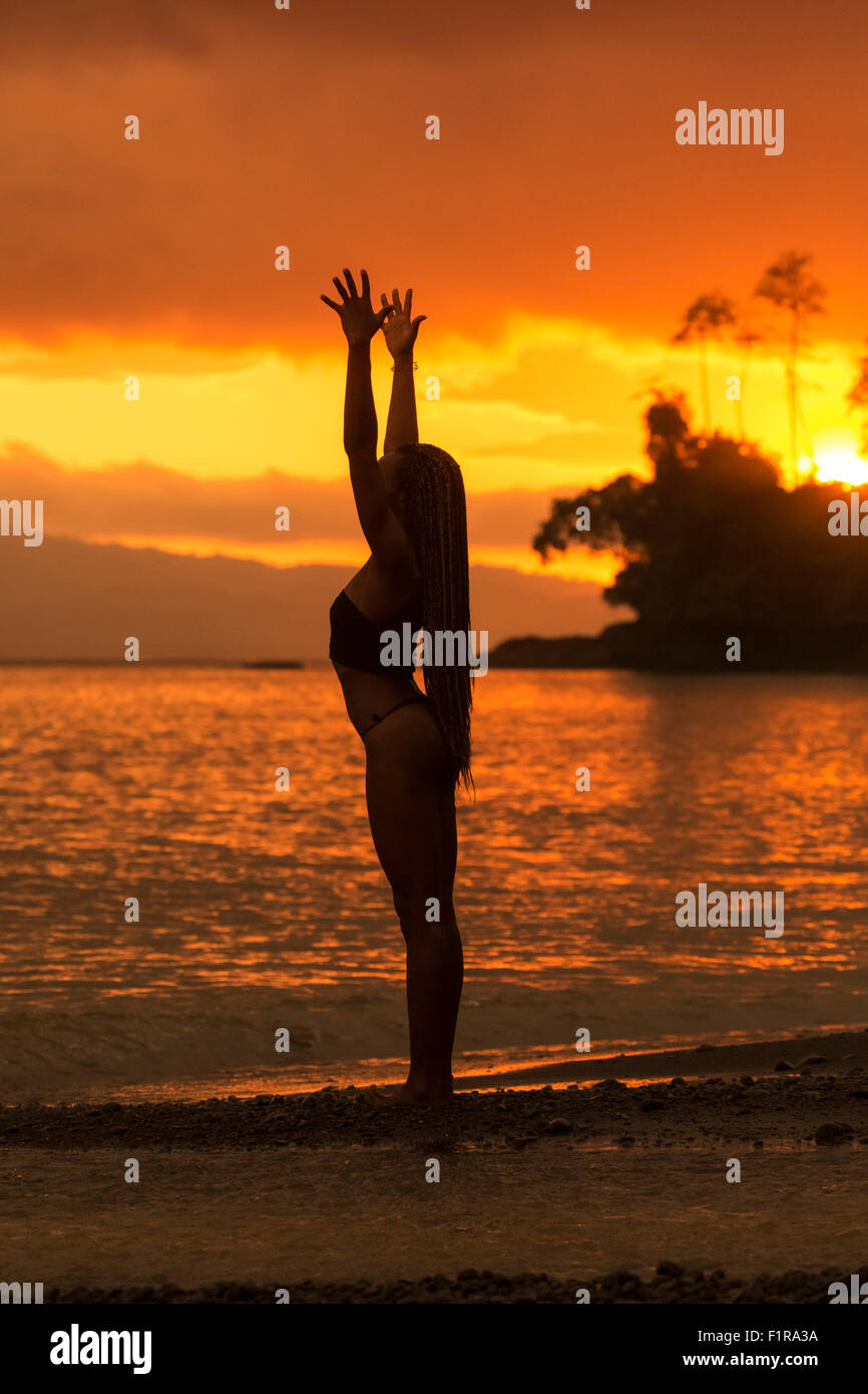 Yoga by the ocean Stock Photo