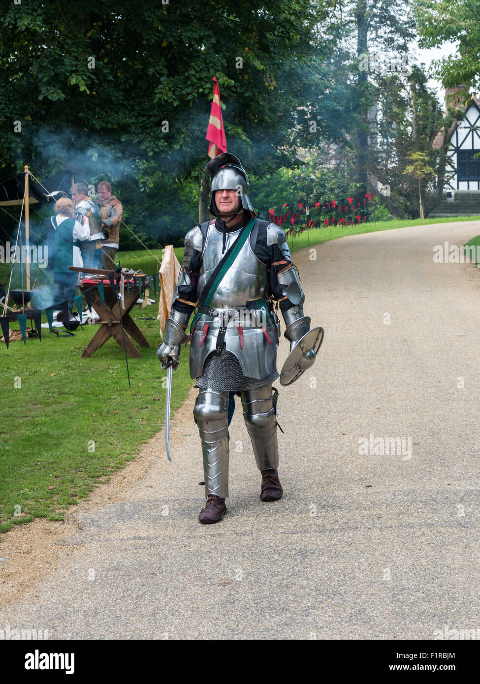 A knight in shining armor prepares for a tournament Stock Photo