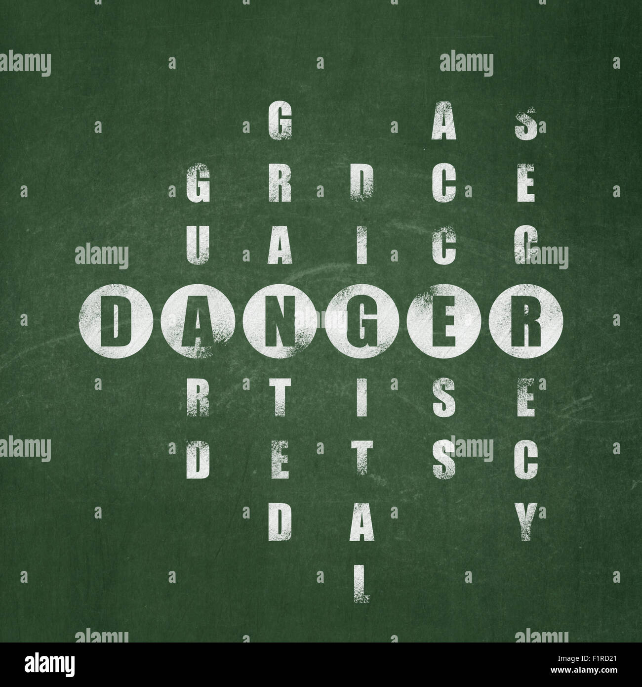 Protection concept word Danger in solving Crossword Puzzle Stock Photo