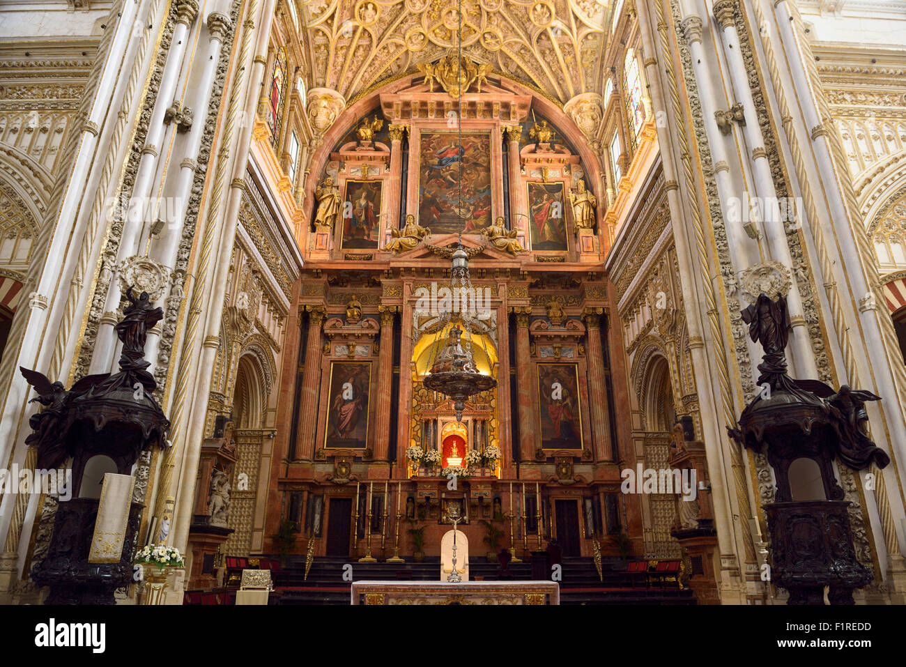 High main altar with carved wood lecterns of the Cordoba Our Lady of the Assumption Cathedral Mosque Stock Photo