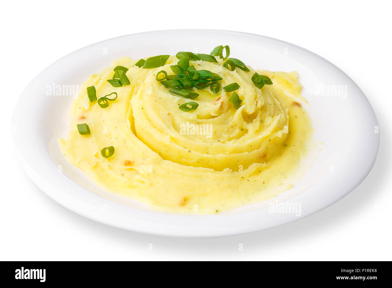 Potato puree with leek on plate isolated on white Stock Photo