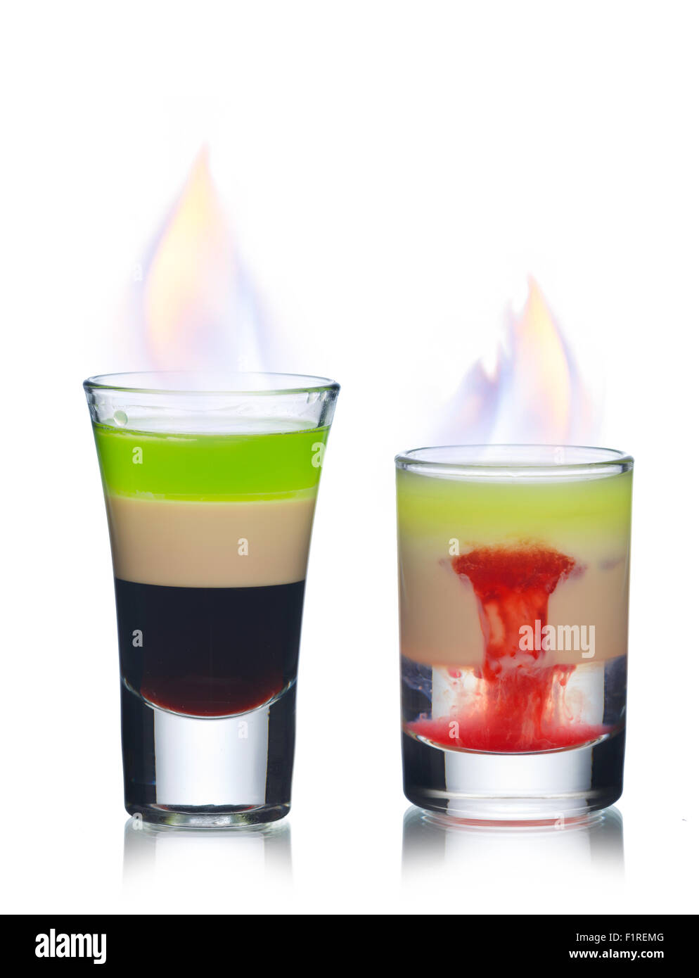 Two burning cocktails in shot glasses Stock Photo
