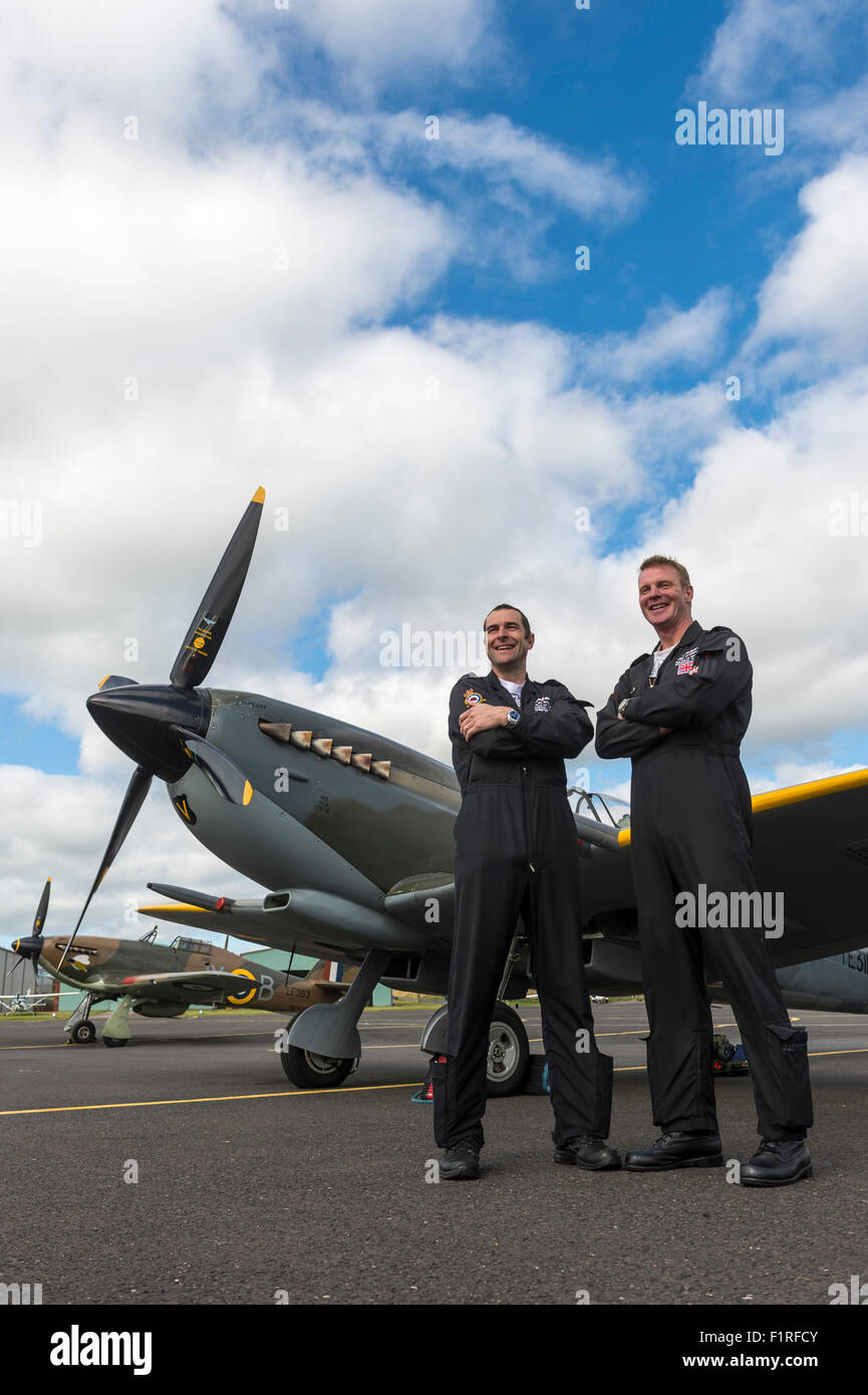 Cumbria, UK. 06th Sep, 2015. World War Two Spitfire and Hurricane flighter planes from The Battle of Britain Memorial Flight land at Carlisle Airport in Cumbria to refuel after performing at air shows at Prestwick and Portrush. Squadron Leader Dunc Mason (left) who pilots the Hawker Hurricane Mark 2C and is the Comanding Officer of the Battle of Britain Memorial Flight with Group Captain Jez Attridge who pilots the Spitfire Mark 16 Credit:  STUART WALKER/Alamy Live News Stock Photo