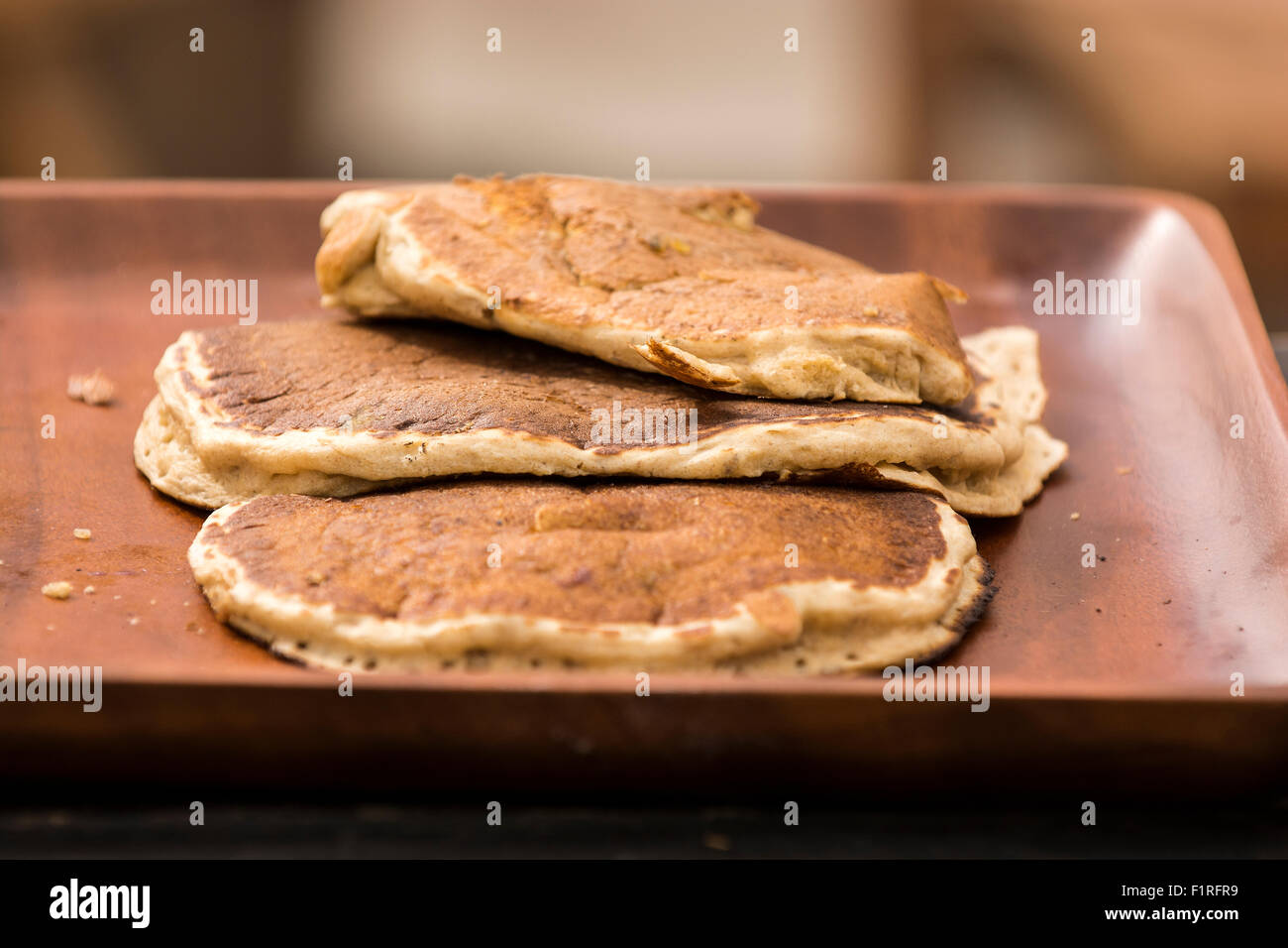 Three pancakes in a plastic tray Stock Photo Alamy