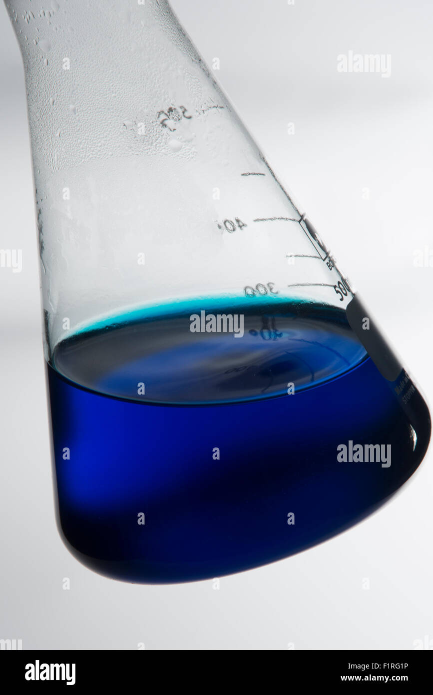 Laboratory flask with blue liquid Stock Photo
