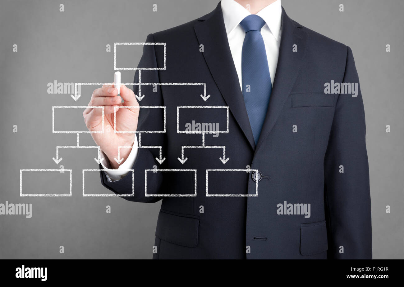 Businessman drawing diagram with chalk Stock Photo