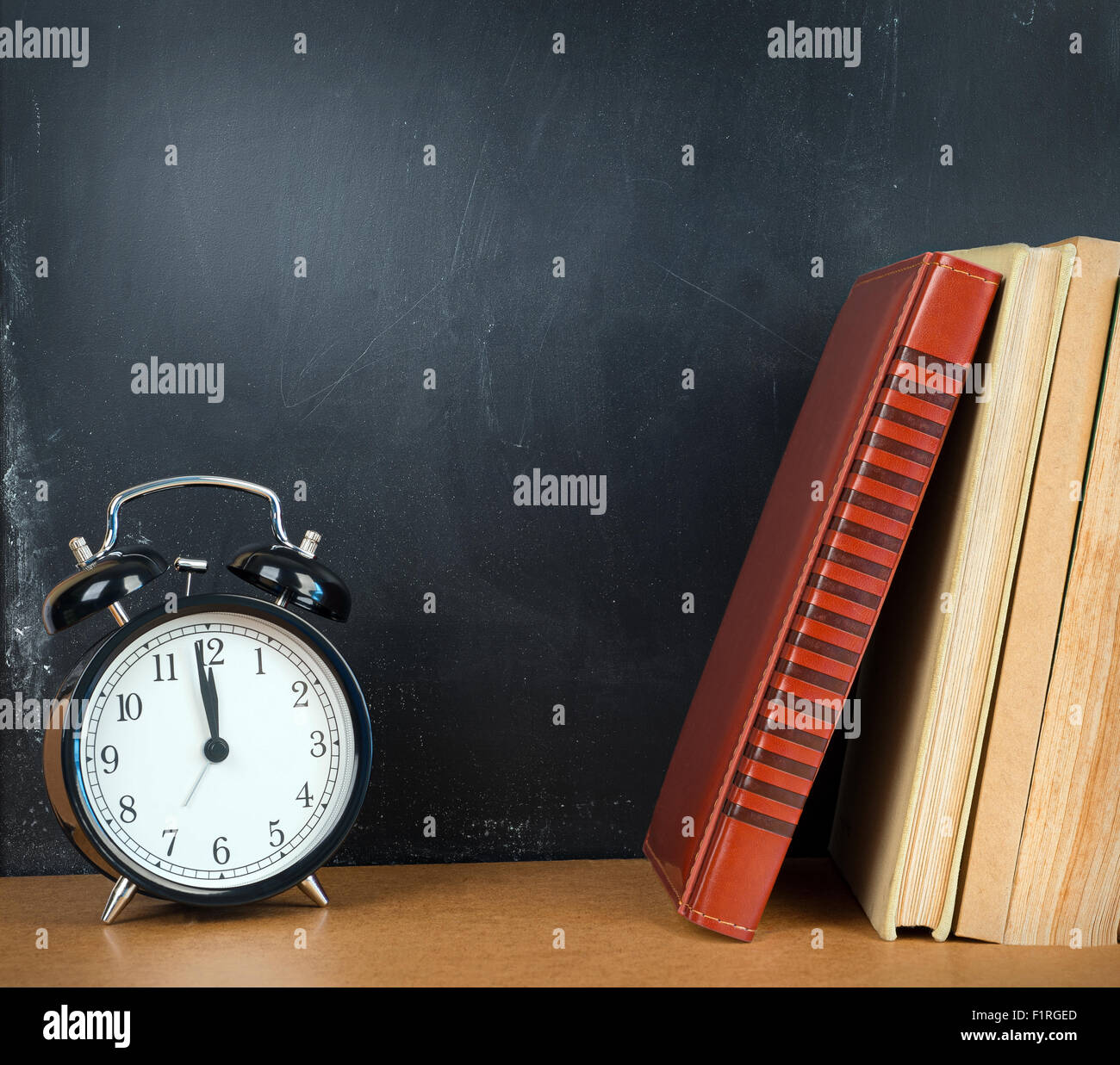Back to school background with books and alarm clock Stock Photo - Alamy