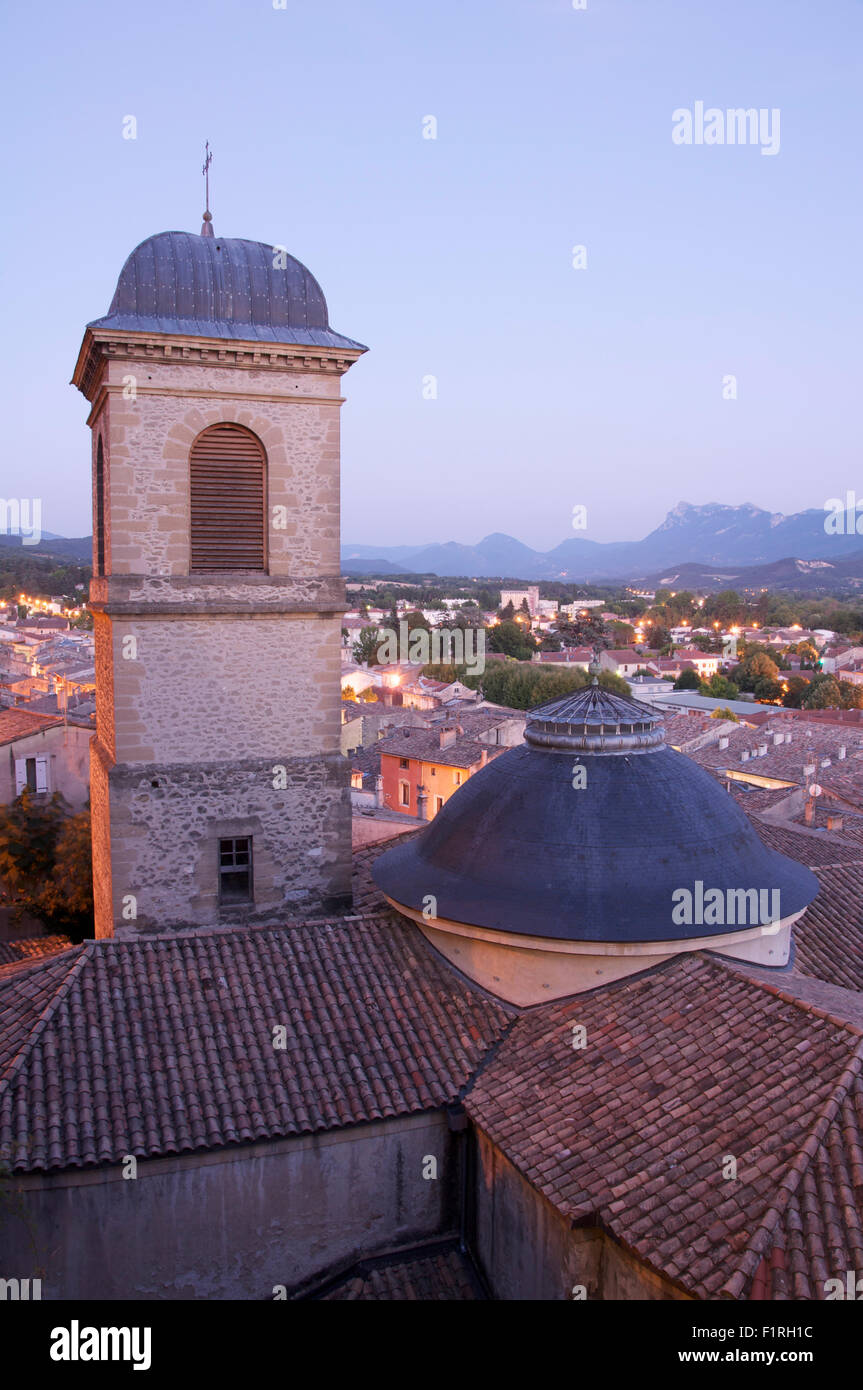 View overlooking the neo classical bell tower of the Church of St Saviour and the rooftops of medieval Crest, La Drôme, France. Stock Photo