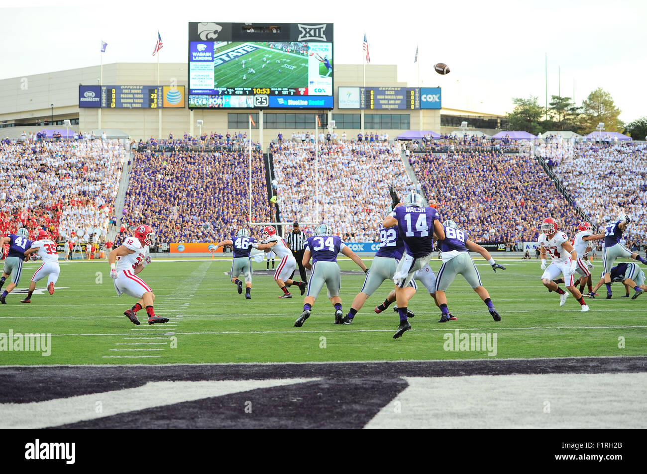 Manhattan, Kansas, USA. 05th Sep, 2015. Kansas State Wildcats punter Nick Walsh (14) punts the ball in the first half against the backdrop of the Vanier Family Football Complex during the NCAA Football game between South Dakota Coyotes and Kansas State at Bill Snyder Family Stadium in Manhattan, Kansas. Kendall Shaw/CSM/Alamy Live News Stock Photo