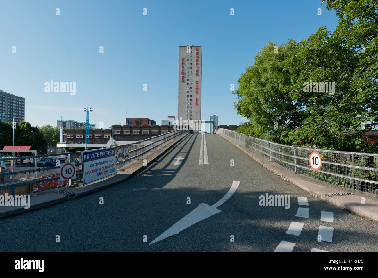 An external shot of the ramp up to Salford Shopping Centre located in Pendleton in Salford, Greater Manchester on a sunny day. Stock Photo