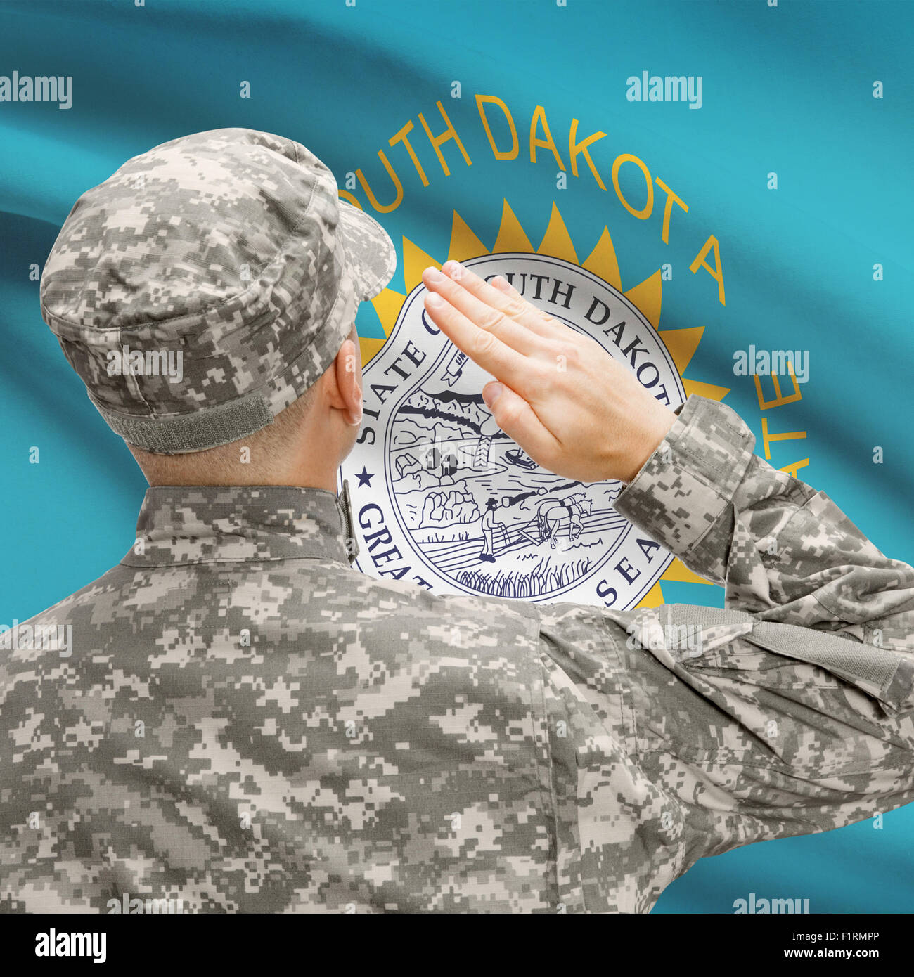 Soldier saluting to USA state flag conceptual series - South Dakota Stock Photo