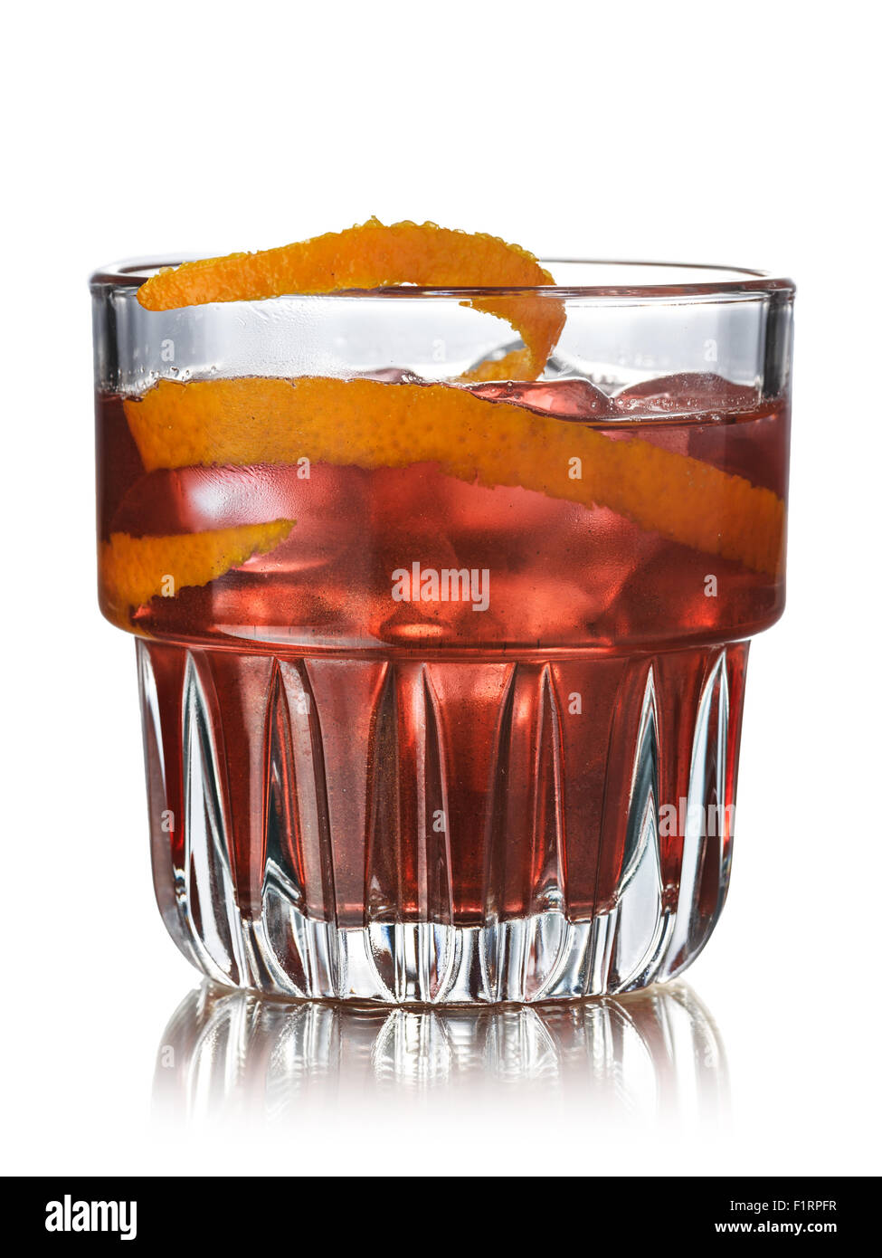 Negroni alcoholic cocktail decorated with orange twist. Before dinner official IBA cocktail Stock Photo