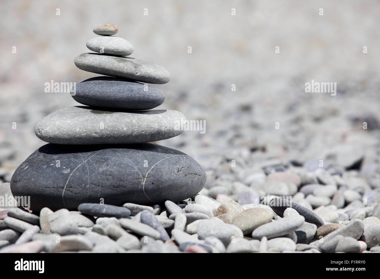 Rocks stacked on the beach Stock Photo Alamy