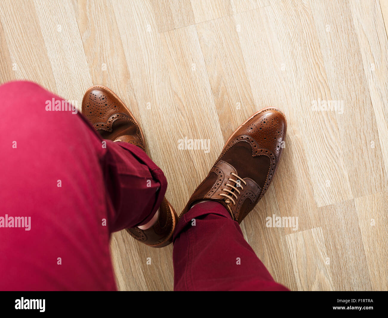Sockless male legs in two tone suede brogues Stylish dressed man wearing cushioned pants and wingtips Stock Photo Alamy