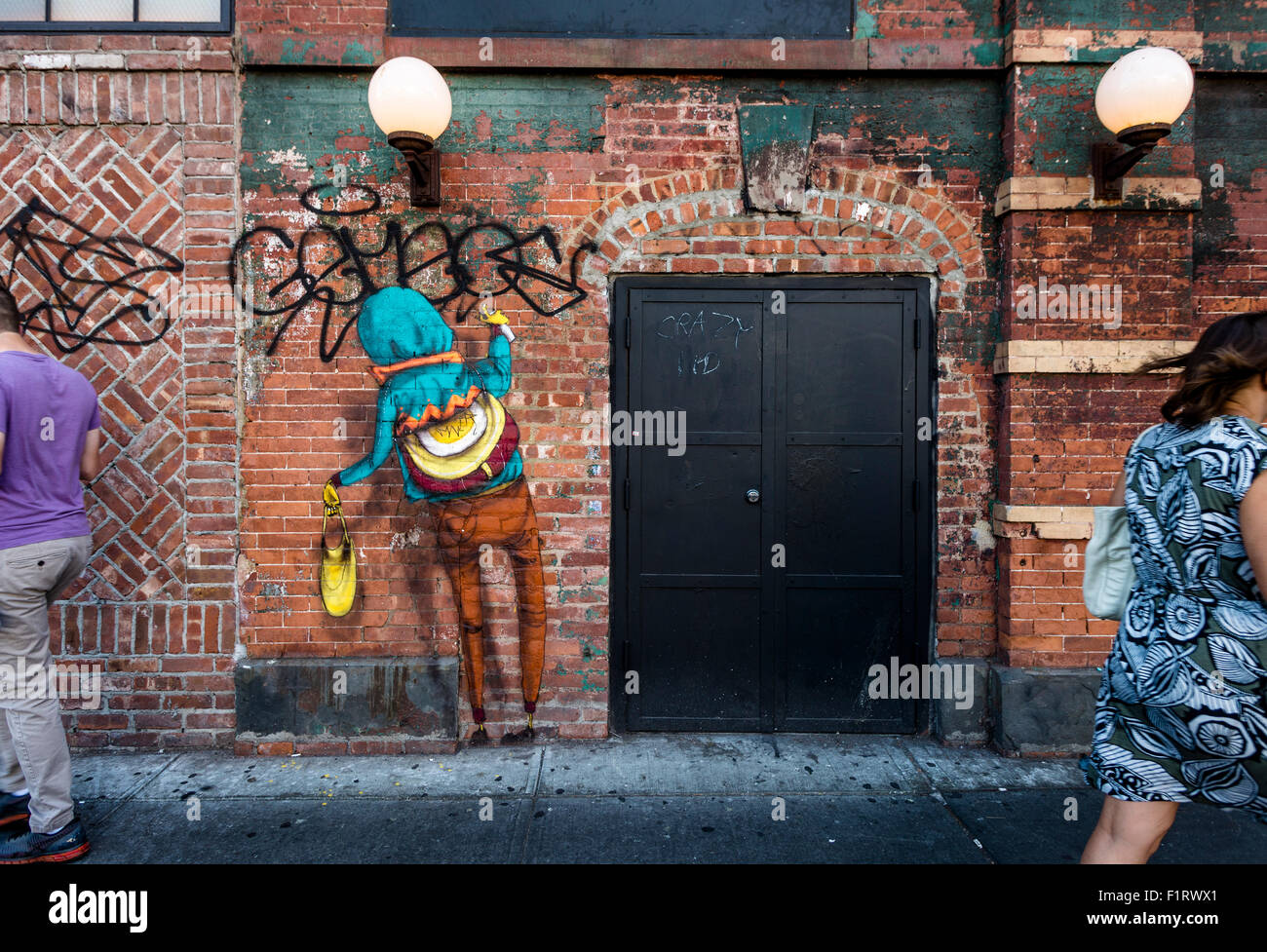 New York, NY 7 September 2015 - Wall mural by the Brazilian twin graffiti artists Os Gemeos, in the Noho neighborhood of Manhattan ©Stacy Walsh Rosenstock/Alamy Stock Photo