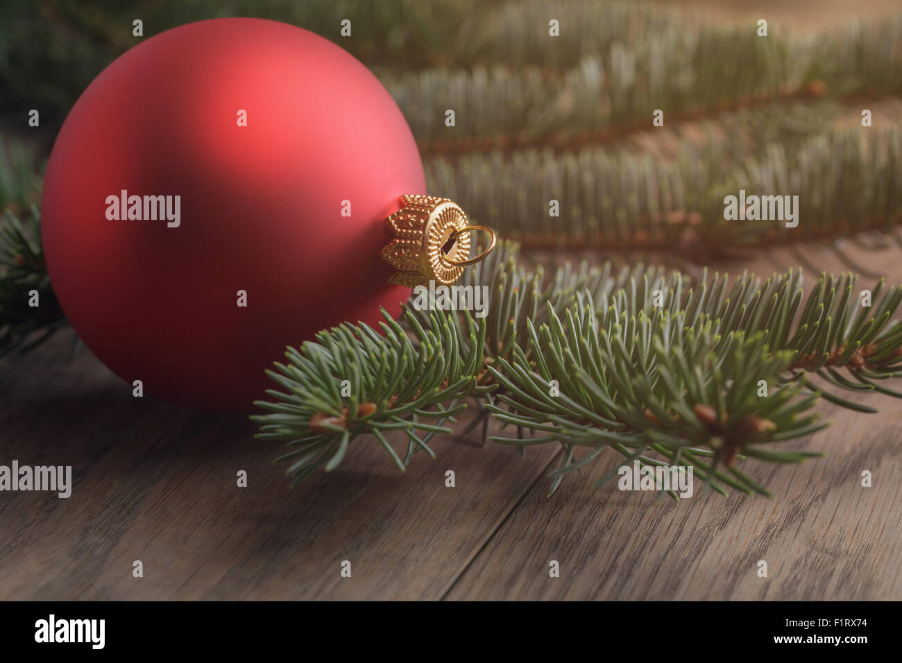 chrismas ball on wood table with spruce Stock Photo